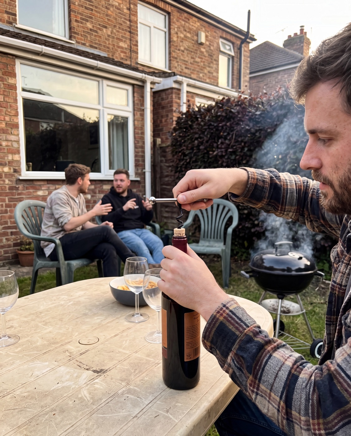 Opening a bottle with the Corklet mounted as a T-handle at a backyard table